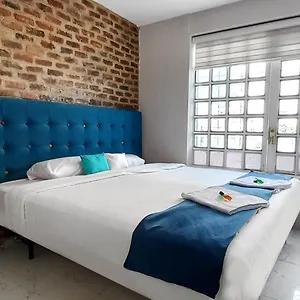 apartasuites-casa-manzini.hotels-bogota.net/